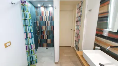 a bathroom with a shower and a sink at Arco del Sole 2 in Palermo