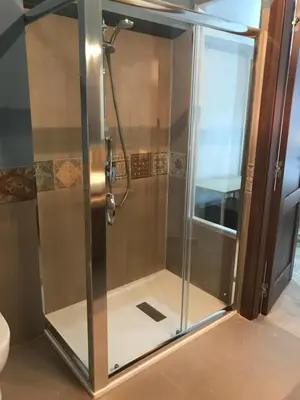 a shower with a glass door in a bathroom at Finisterre in San Vito lo Capo