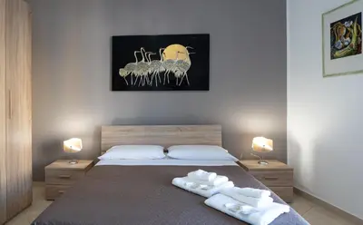 a bedroom with a bed with two towels on it at B&B Una Terrazza sul Golfo di Sferracavallo in Sferracavallo