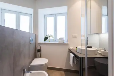 a bathroom with a toilet and a sink at Dietro la Cattedrale in Palermo