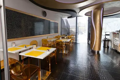 a dining room with tables and chairs in a restaurant at Mille e Una Notte in Nuova Gibellina