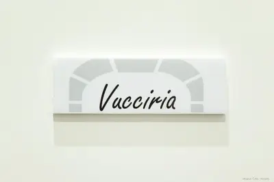 a sign that says vaporetto on a white wall at Maison Cutò in Palermo
