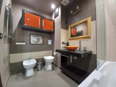 a bathroom with a toilet and a sink and a mirror at Casa sul mare in Isola delle Femmine