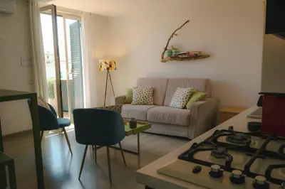 a living room with a couch and a stove at Central Apartment with terrace near teatro Massimo in Palermo