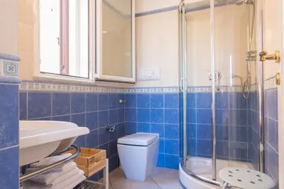 a bathroom with a toilet and a sink and a shower at Casa da Silvia in Palermo