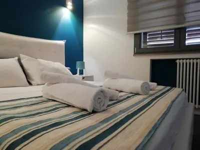 a bedroom with a bed with towels on it at LOFT 99 in Palermo
