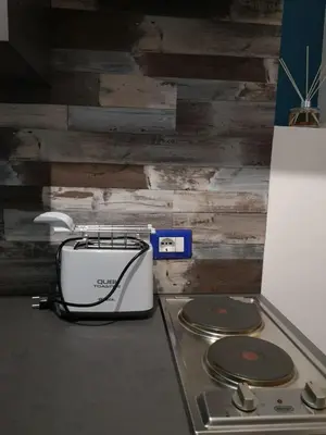 a toaster sitting on a stove in a kitchen at LOFT 99 in Palermo