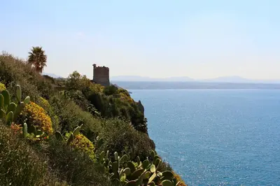 a castle on top of a hill next to the ocean at La Caletta Casa Vacanze, PRIVATE POOL in Terrasini