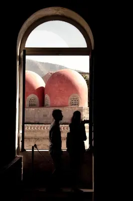 two people standing in front of a window at Mamamia #Politeama in Palermo