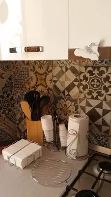 a kitchen counter with utensils on a counter top at Casa Ruggiero in Palermo