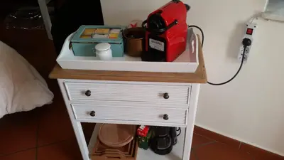 a small white dresser with a counter top at Casa Ruggiero in Palermo