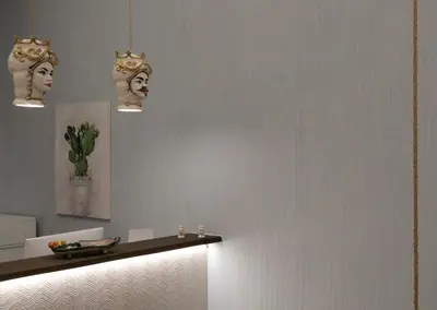 a room with two masks on the wall at Cocciu d'amuri in San Vito lo Capo