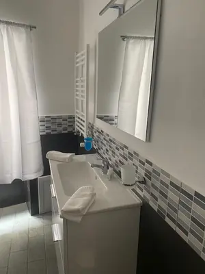 a bathroom with a sink and a mirror at La Querencia in Palermo