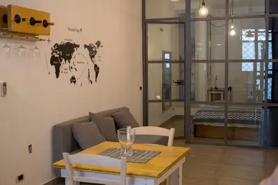 a living room with a couch and a table at La Casetta delle Scienze in Palermo