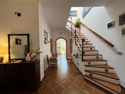 a hallway with a staircase in a house at Da Sophie in Mondello