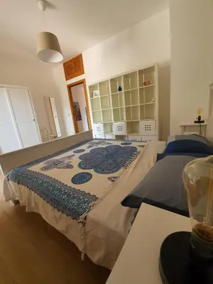 a bedroom with two beds in a room at La Locanda del Cedro in Palermo