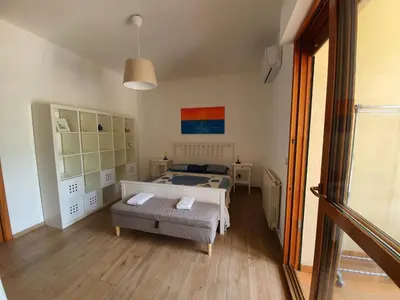 a bedroom with a bed and a table in it at La Locanda del Cedro in Palermo