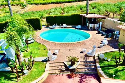 an overhead view of a swimming pool in a yard at Villa Grisì in Partinico