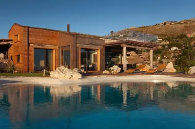 a house on the shore of a body of water at Casa Saleiman in Castellammare del Golfo
