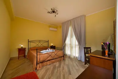 a bedroom with a bed and a window at Al Cantuccio in Castelluzzo