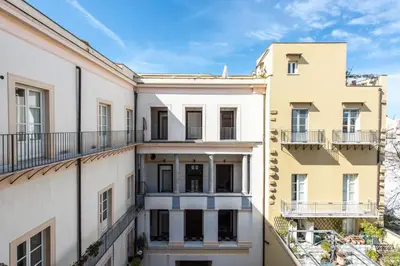 an image of an apartment building with balconies at Palazzo Castrofilippo Apartment by Wonderful Italy in Palermo