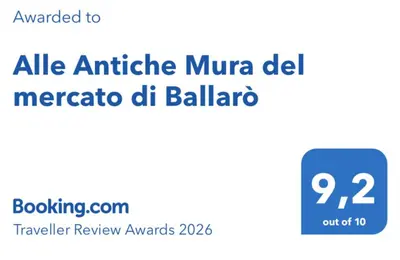 a screenshot of a cell phone with theania mumma del mercato del bal at Alle Antiche Mura del mercato di Ballarò in Palermo