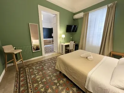 a hotel room with a bed and a mirror at Bed in Spa in Palermo