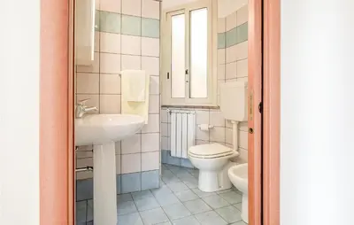 a bathroom with a toilet and a sink at Casa Antonio in Mandra Capreria