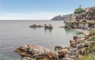 a large body of water with rocks in it at Casa Giuseppa in Mandra Capreria