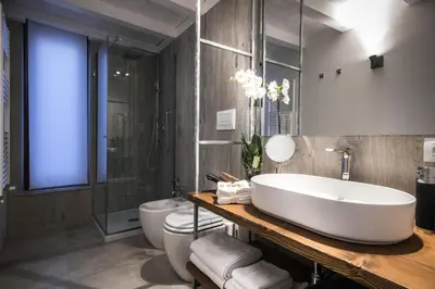 a bathroom with a tub and a toilet and a sink at A&G Dimore di Famiglia - Un Lusso Garbato in Palermo