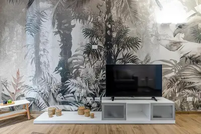 a tv on a stand in a room with a mural at Solemar Sicilia - Galleria Maqueda in Palermo