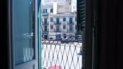 a view of a city street from a window at LE PORTE DI PALERMO in Palermo
