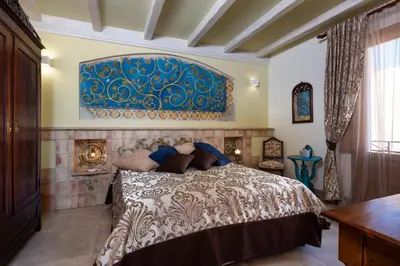 a bedroom with a bed and a blue and white wall at Azulè in San Vito lo Capo