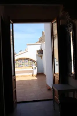 an open door to a room with a balcony at Azulè in San Vito lo Capo