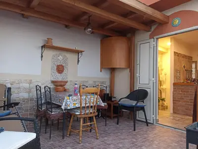 a kitchen and dining room with a table and chairs at Torre Vallelunga in Trabia