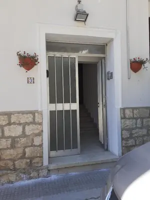 a door leading into a building with a staircase at Duchessa in Castellammare del Golfo