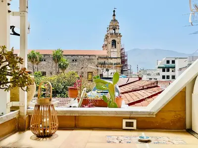 a balcony with a view of a church at Gagini House & Terrace in Palermo