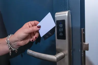 a woman holding a piece of paper in a door at Mosina Apartments in Palermo
