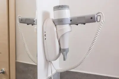 a phone is hanging on a door at Mosina Apartments in Palermo