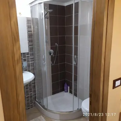 a bathroom with a shower with a toilet and a sink at STONE HOUSE e Casa Vacanze Zia Rosina in Montemaggiore Belsito