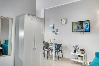 a room with a table and a dining room at Annina'S Home Panoramic sea view By Sicily Home Solutions in Castellammare del Golfo