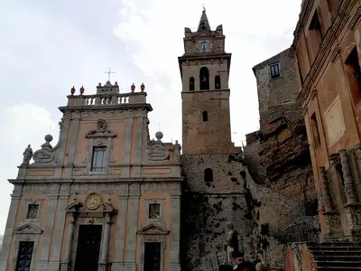 an old building with a clock tower on top of it at cocciu d'amuri in Caccamo