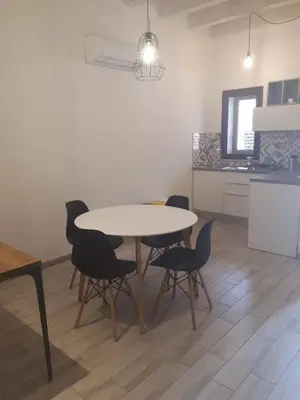 a dining room table and chairs in a kitchen at Casa di Magda in Castellammare del Golfo