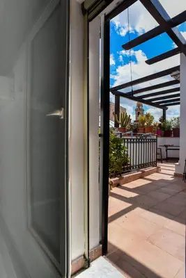 a sliding glass door to a patio with a view at Rooms 19 B&B in Palermo