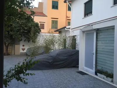 a bedroom with two beds and a window at White Home. Casa Relax, piscina, free wi-fi & posto auto. in Palermo