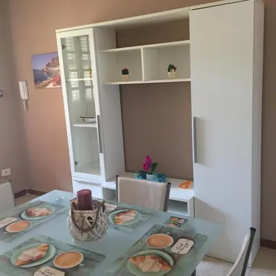 a dining room table with plates of food on it at George House Mondello 32 in Mondello