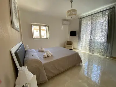 a bedroom with a bed with two stuffed animals on it at Apartment Rua Formaggi in Palermo