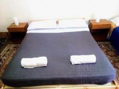 a bedroom with a bed with two towels on it at Arco di ballarò in Palermo