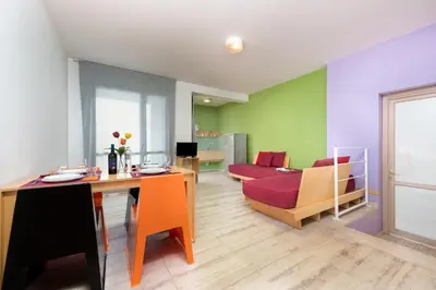 a living room with a couch and a table at Vitorno Residence in San Vito lo Capo