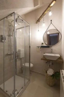 a bathroom with a glass shower and a sink at SICULI HORTIS SEA HOME - Villa - Jacuzzi - Air Conditioning - Free Parking - Video Surveillance & Alarm System in Altavilla Milicia